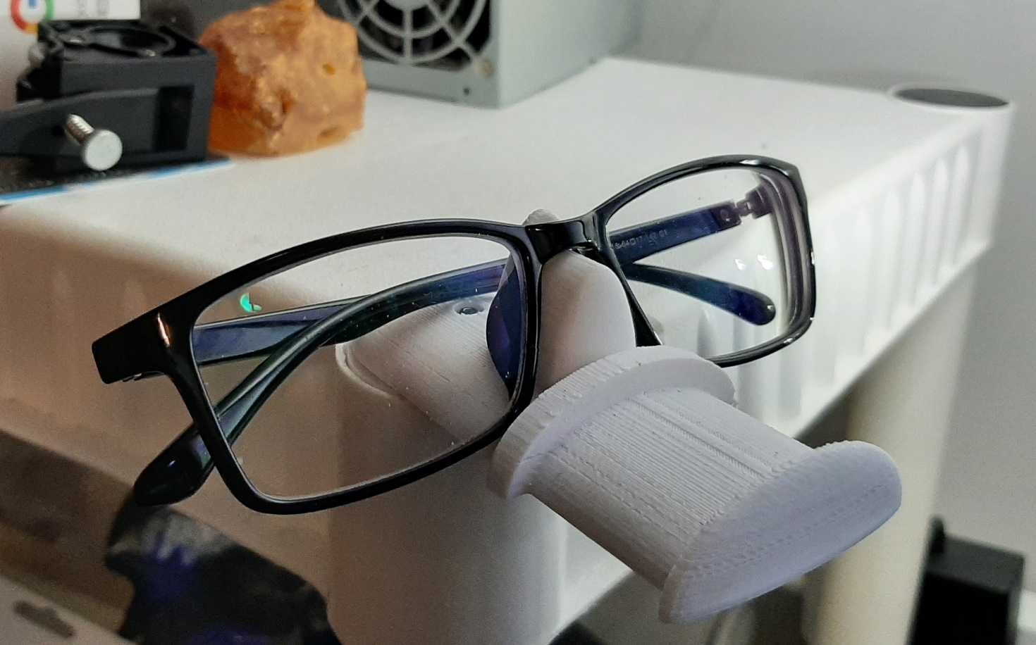 plastic shelf glasses and headphone holder