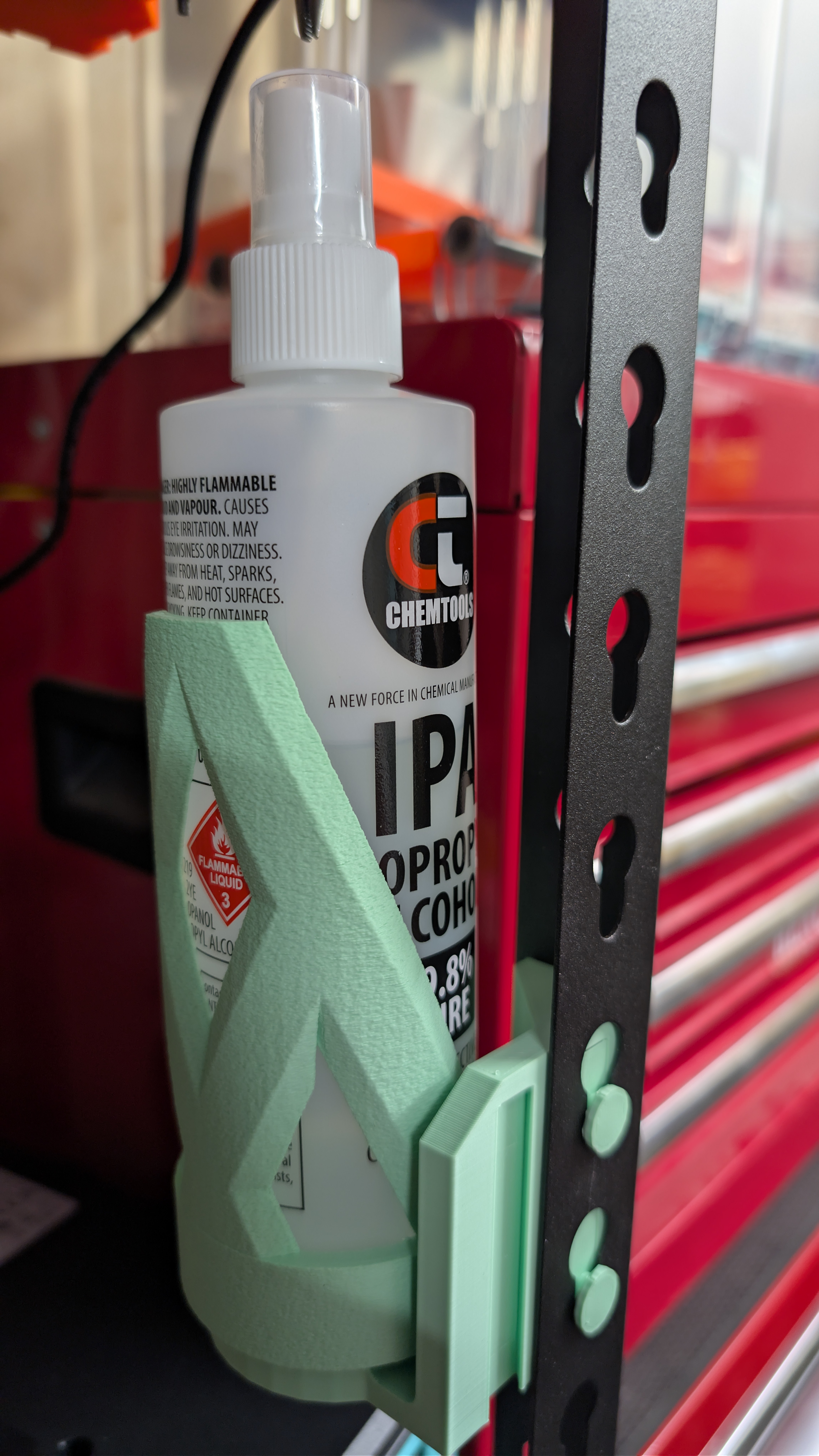 Bottle holder with rotatable cage for IPA 250ml  (or other similarly sized bottle) for teardrop-slotted angle shelving
