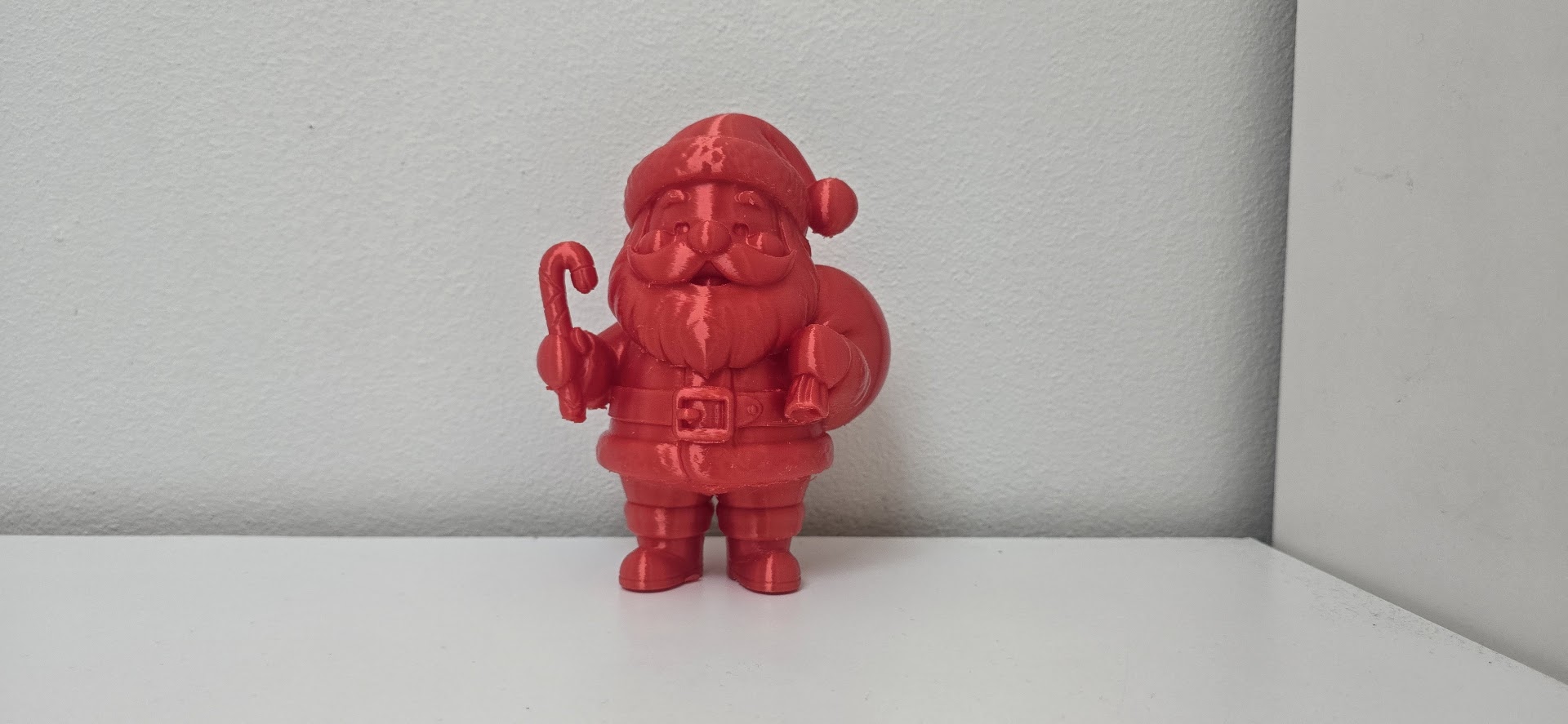 Santa Claus with Candy Cane and Gift Sack Christmas Figurine