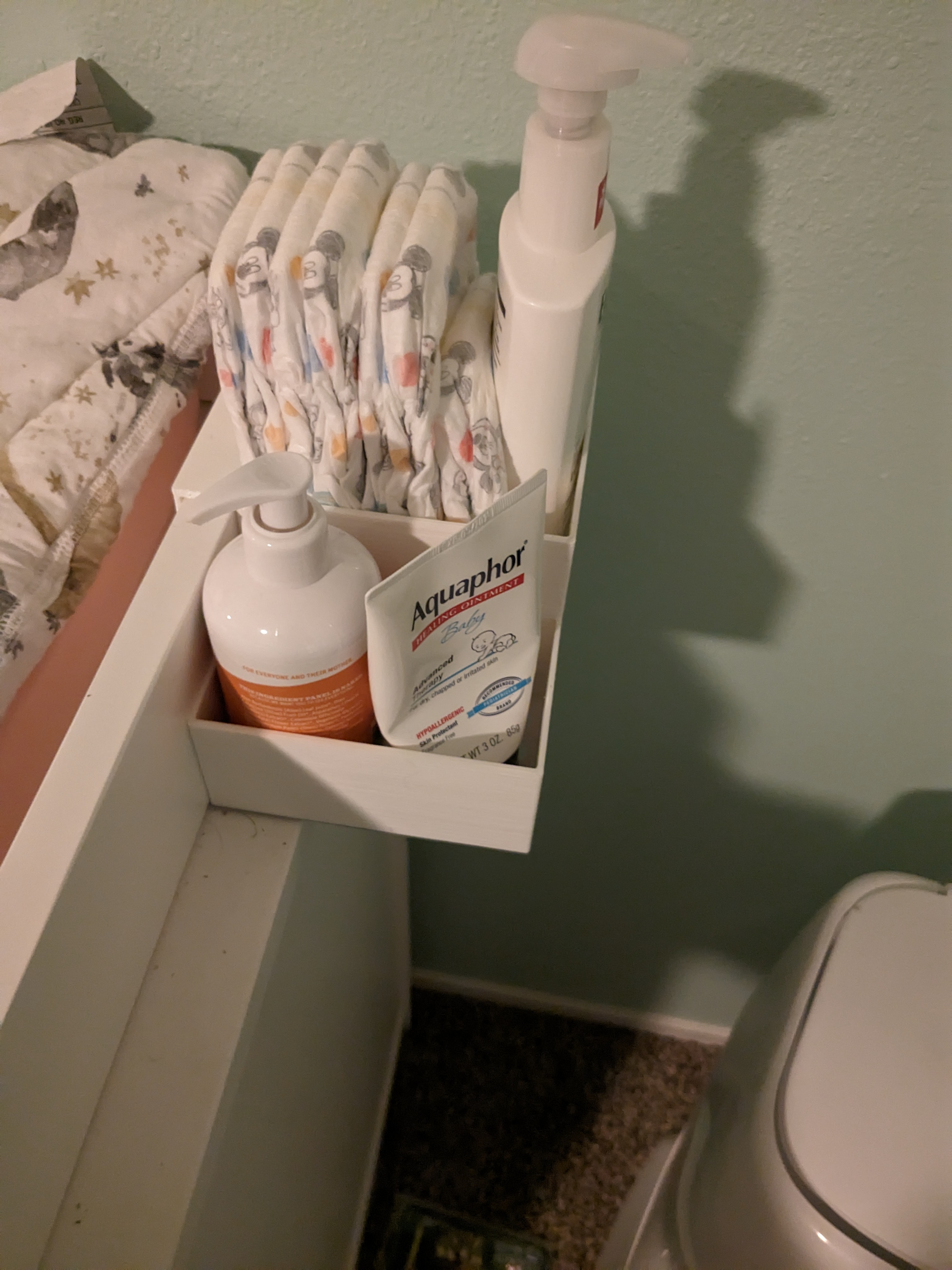 Changing table diaper holder