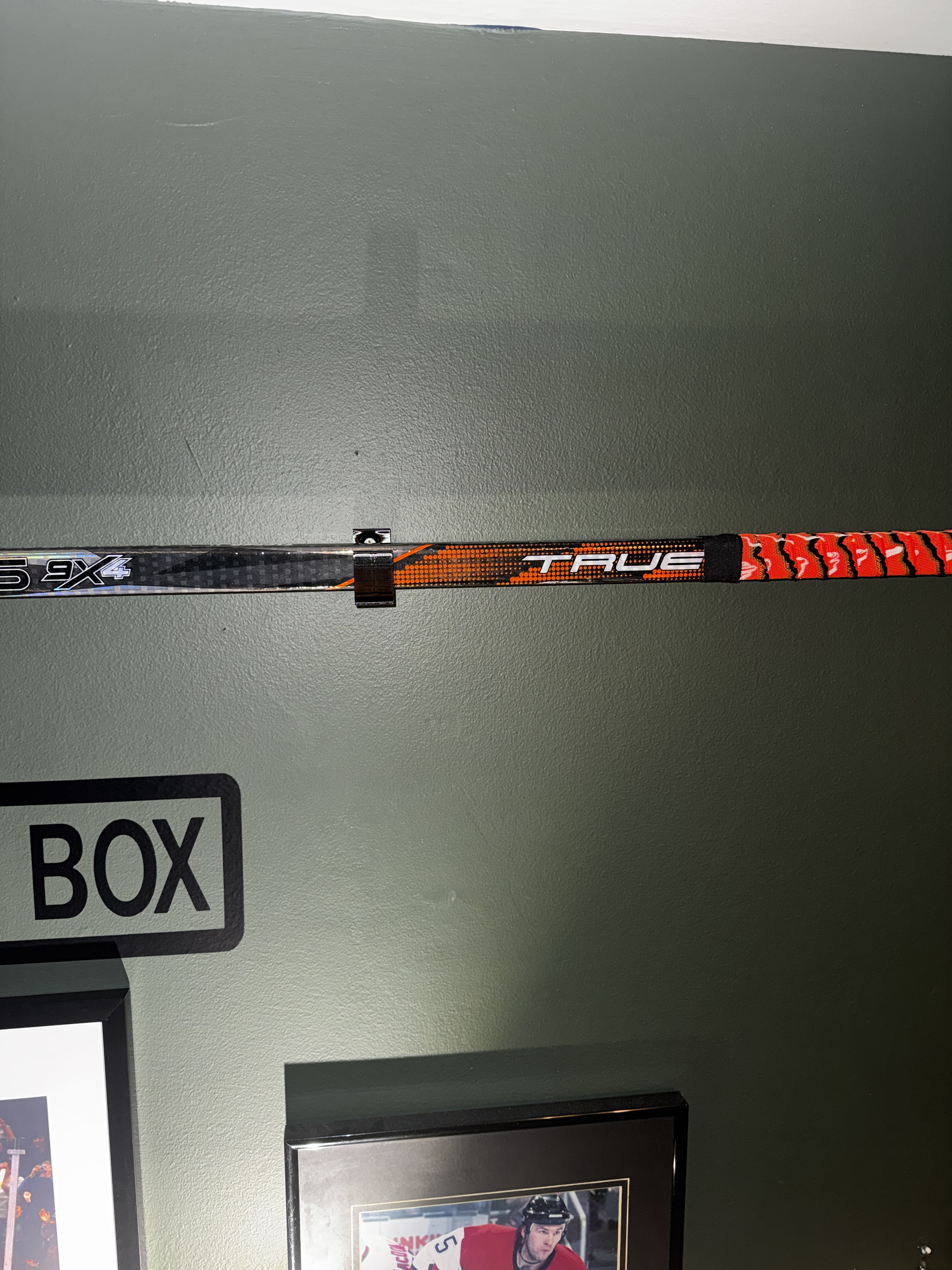 Hockey stick display holder