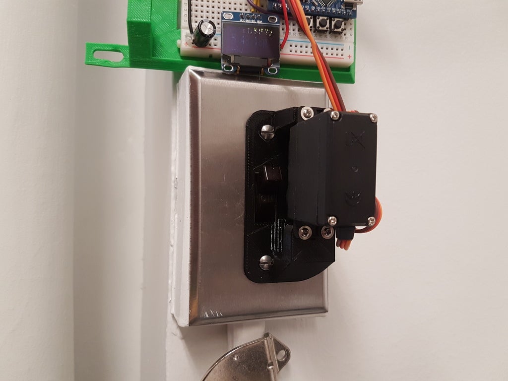 Servo bracket to control a U.S. wall switch v2 (bigger servo!) by