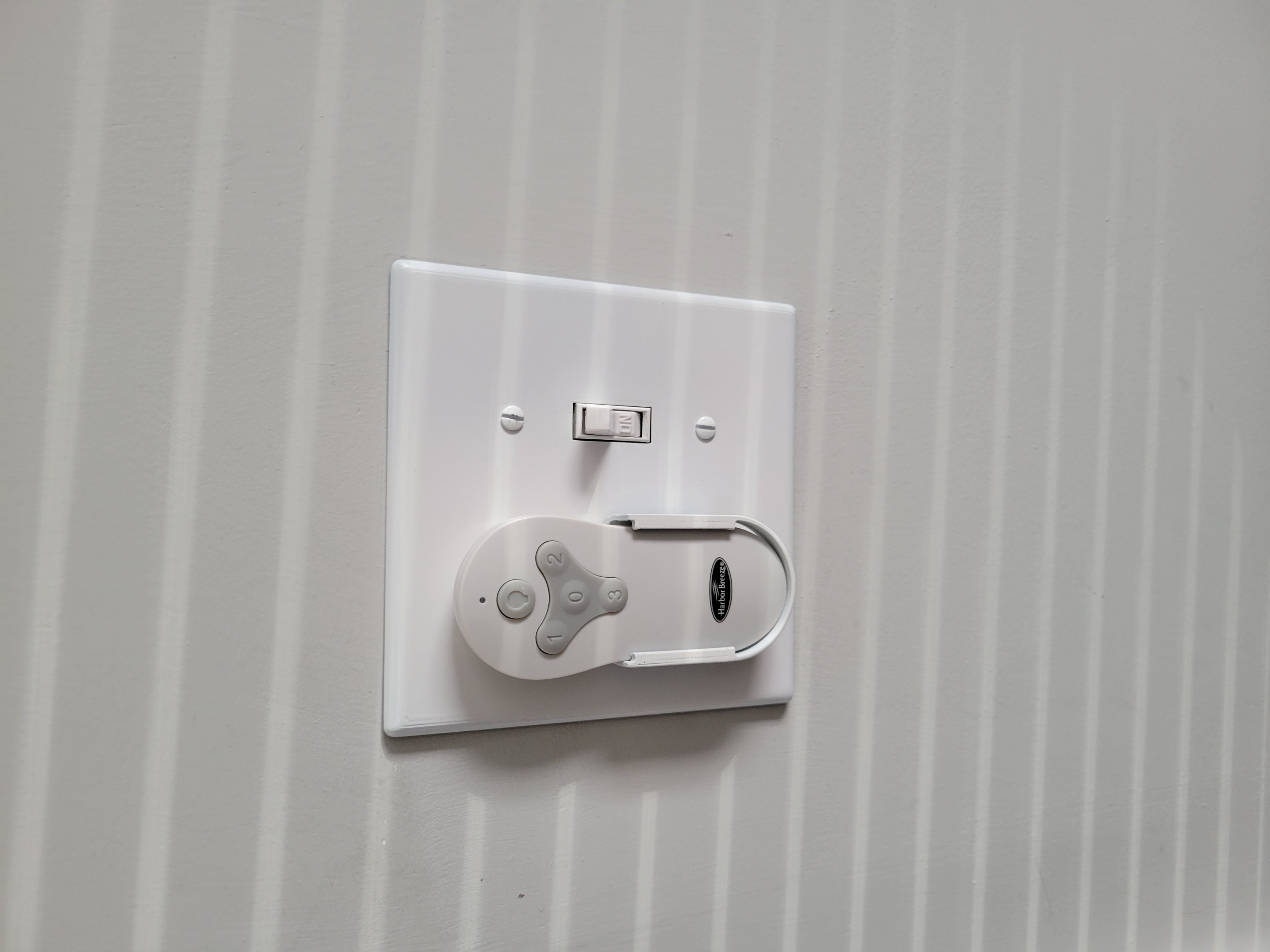 Light Switch with harbor breeze remote holder
