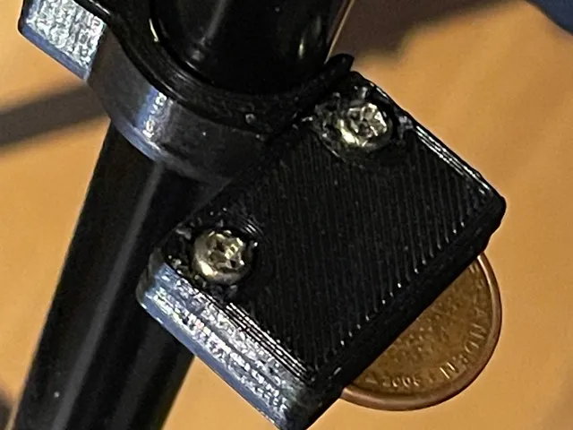 Coin clip for camera stand
