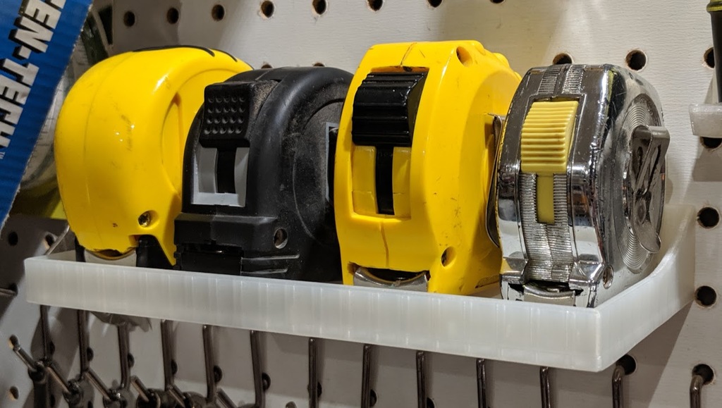 Tape Measure Holder for Pegboard by huberjer Download free STL model