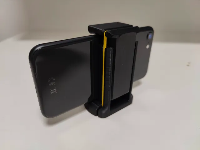 Phone holder for a tripod