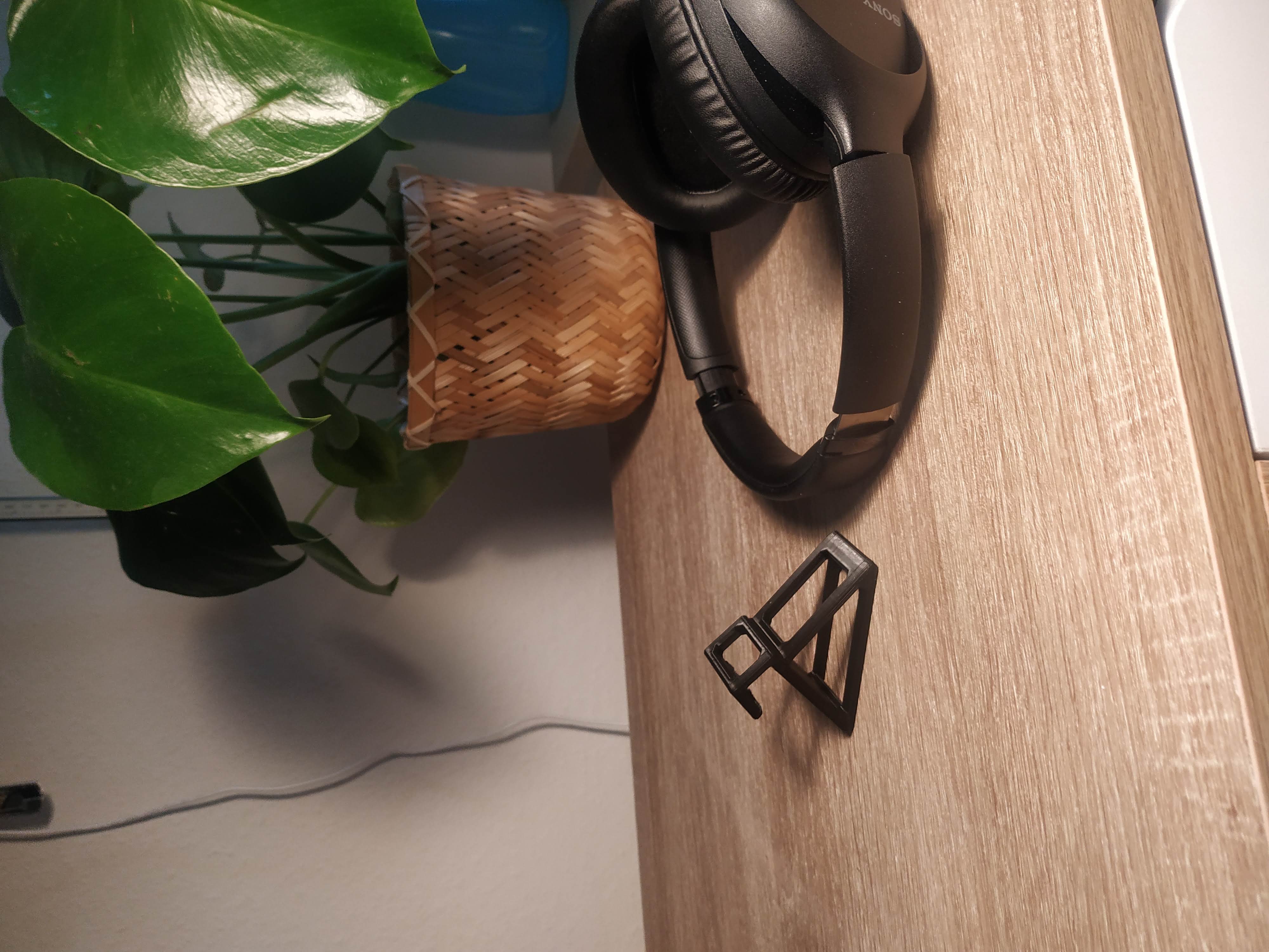 Headphones holder for monitor background