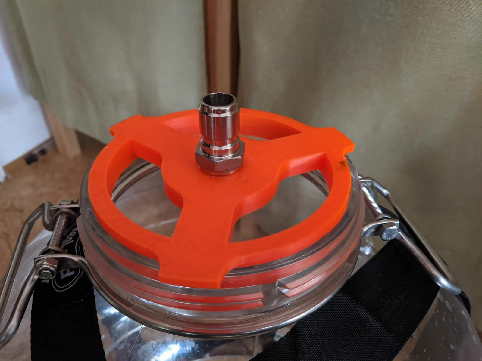 Hose holder mounted on a Fermzilla-style fermenter