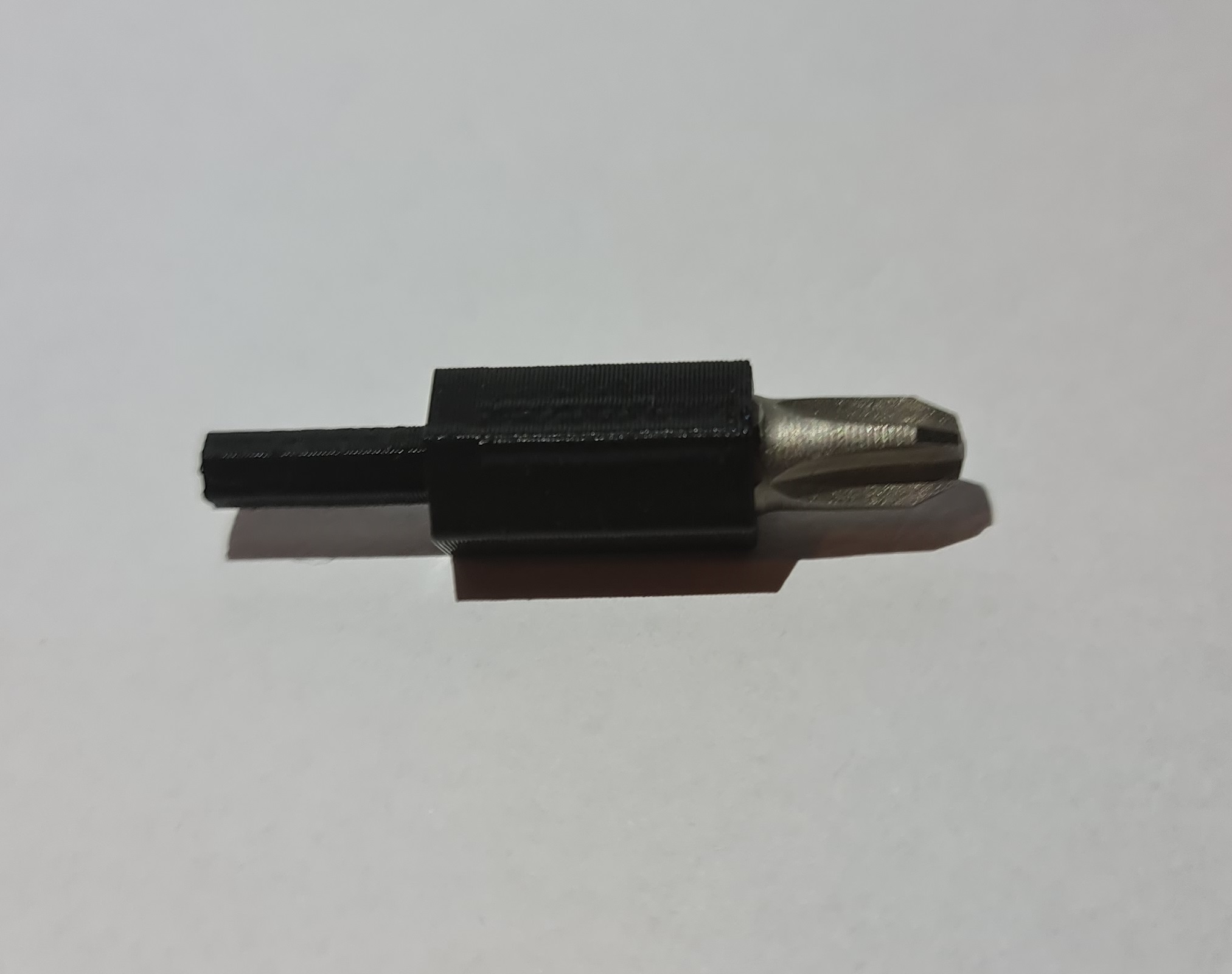 Configurable driver bit adapter (use larger bits in a smaller driver)