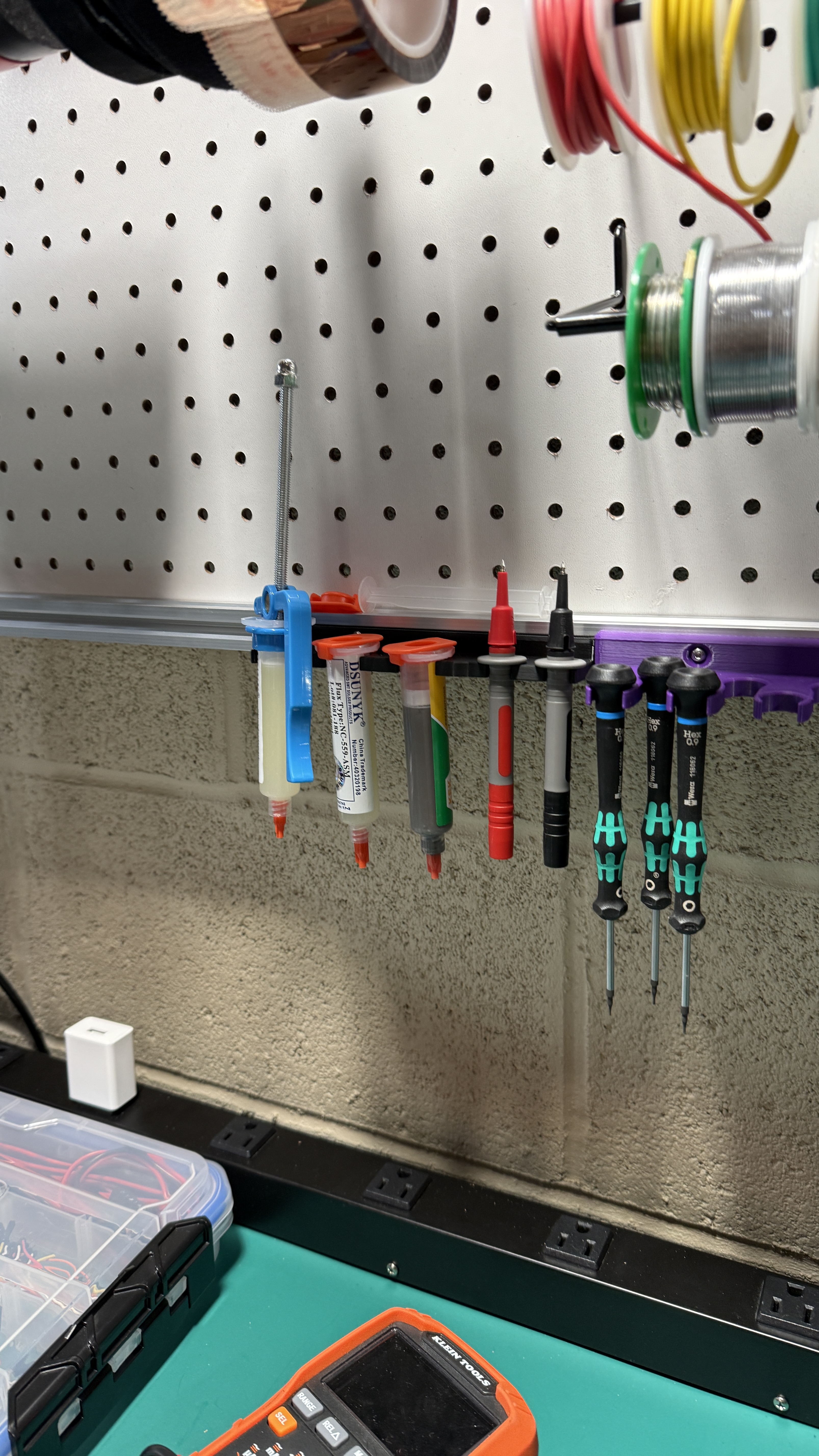 Holds tubes of flux, solder paste and multimeter leads
