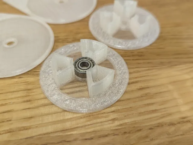 Larger diameter center wheel with bearing