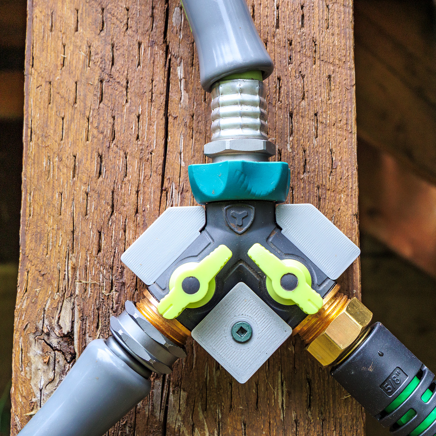 A "Y" connector bracket for garden hoses