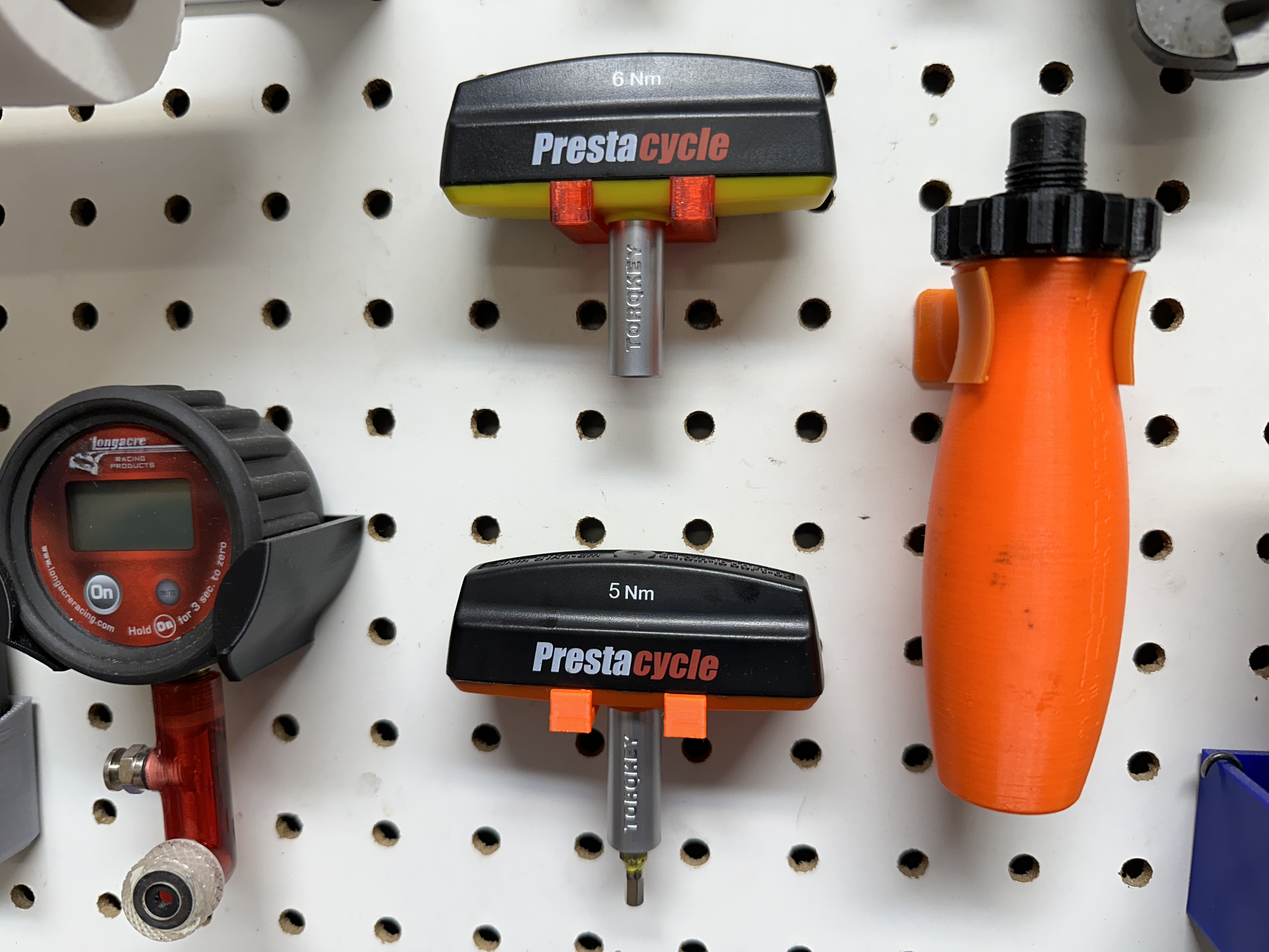 Pegboard holder for Torqkey fixed torque wrench