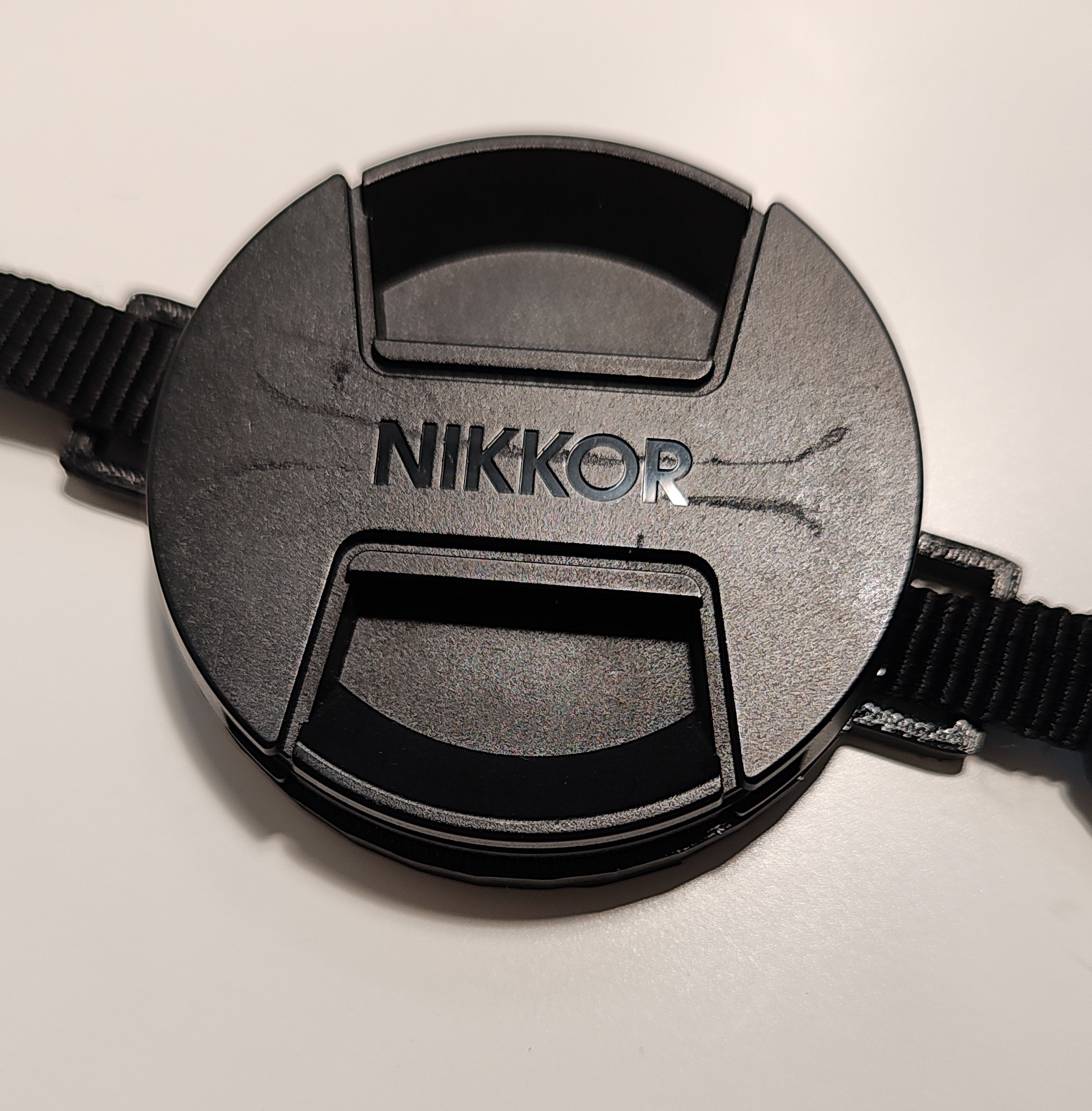 Lens cap strap holder by kszyh Download free STL model