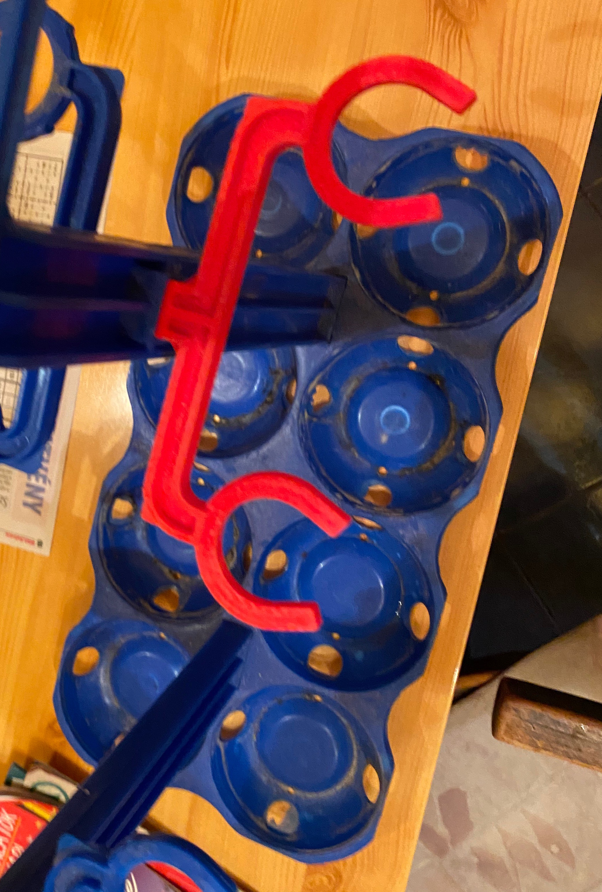 Soda bottle storage container spare arm