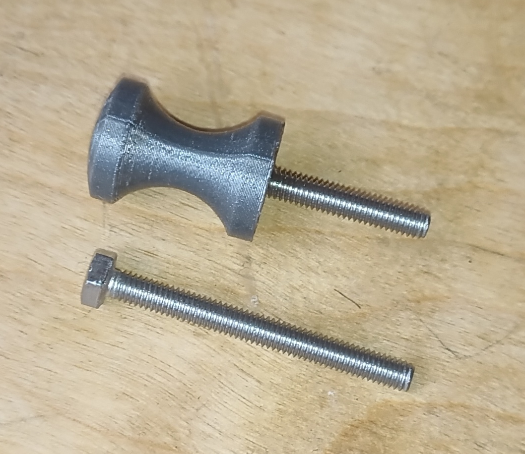 Wall peg with embedded metallic screw