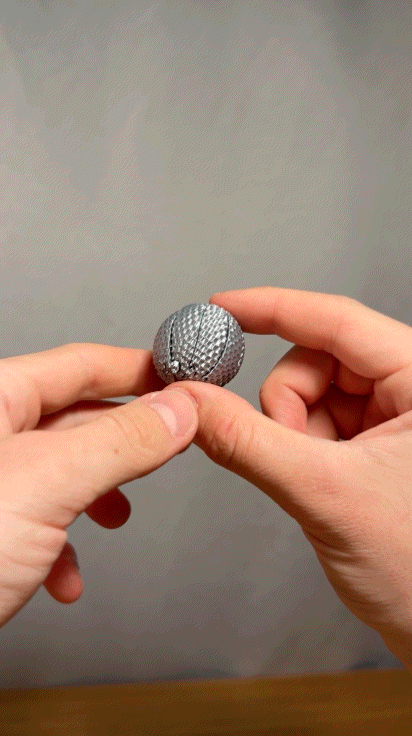 Miniatura 2 do modelo 3D Mini Dimpled Sensory Sphere Twisty Fidget Toy