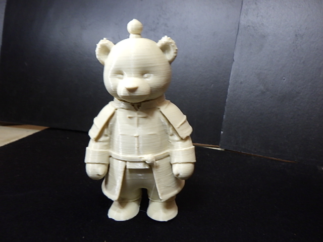 Cute teddy bear in a robe.