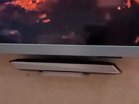 A TV remote shelf for wall mounted Philips TV