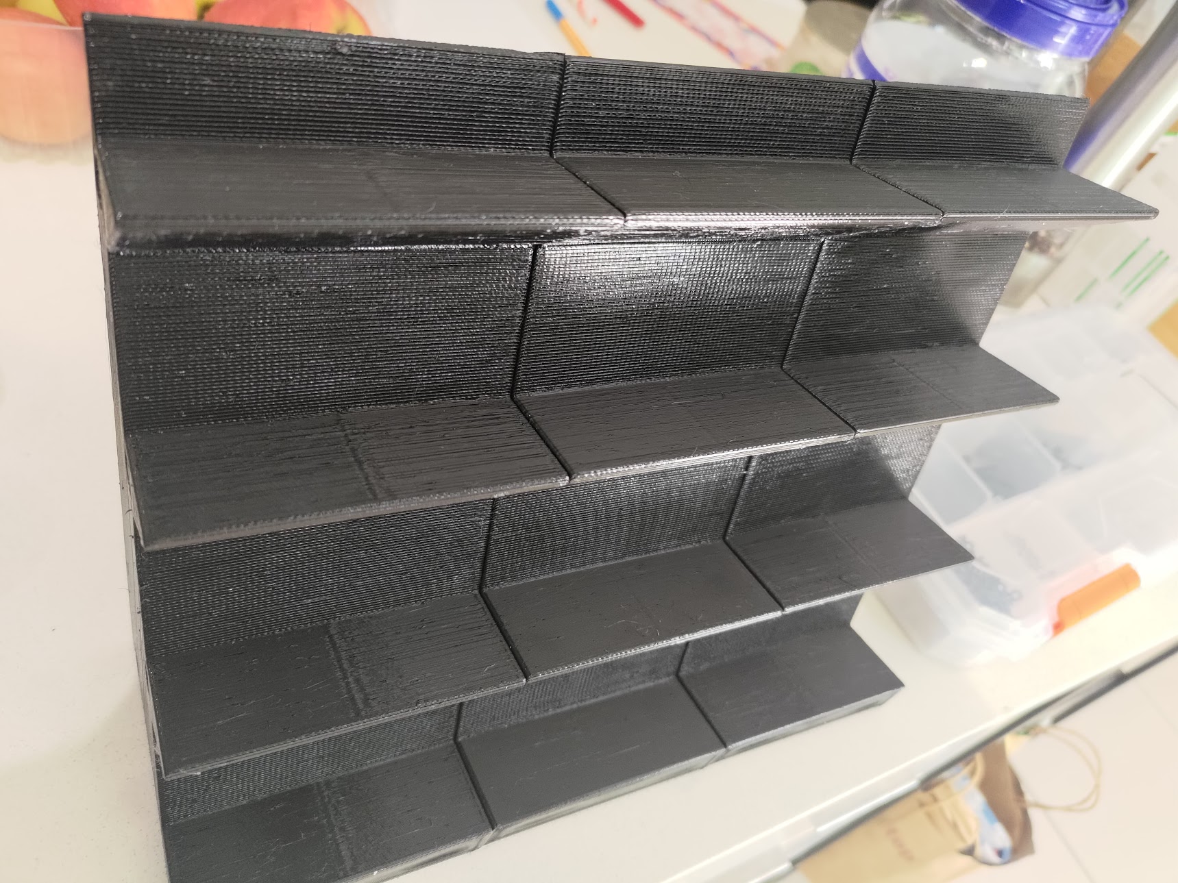 Storage rack for long cylindrical objects that may have a flared base