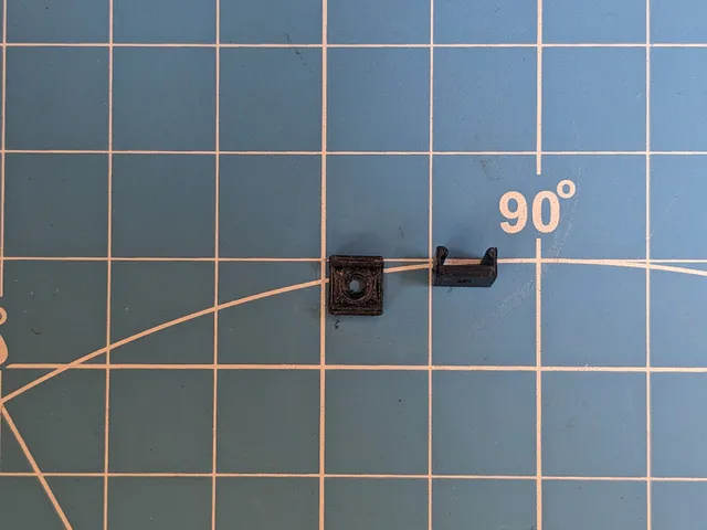 Parameteric flat cable clip with coutersunk screw hole