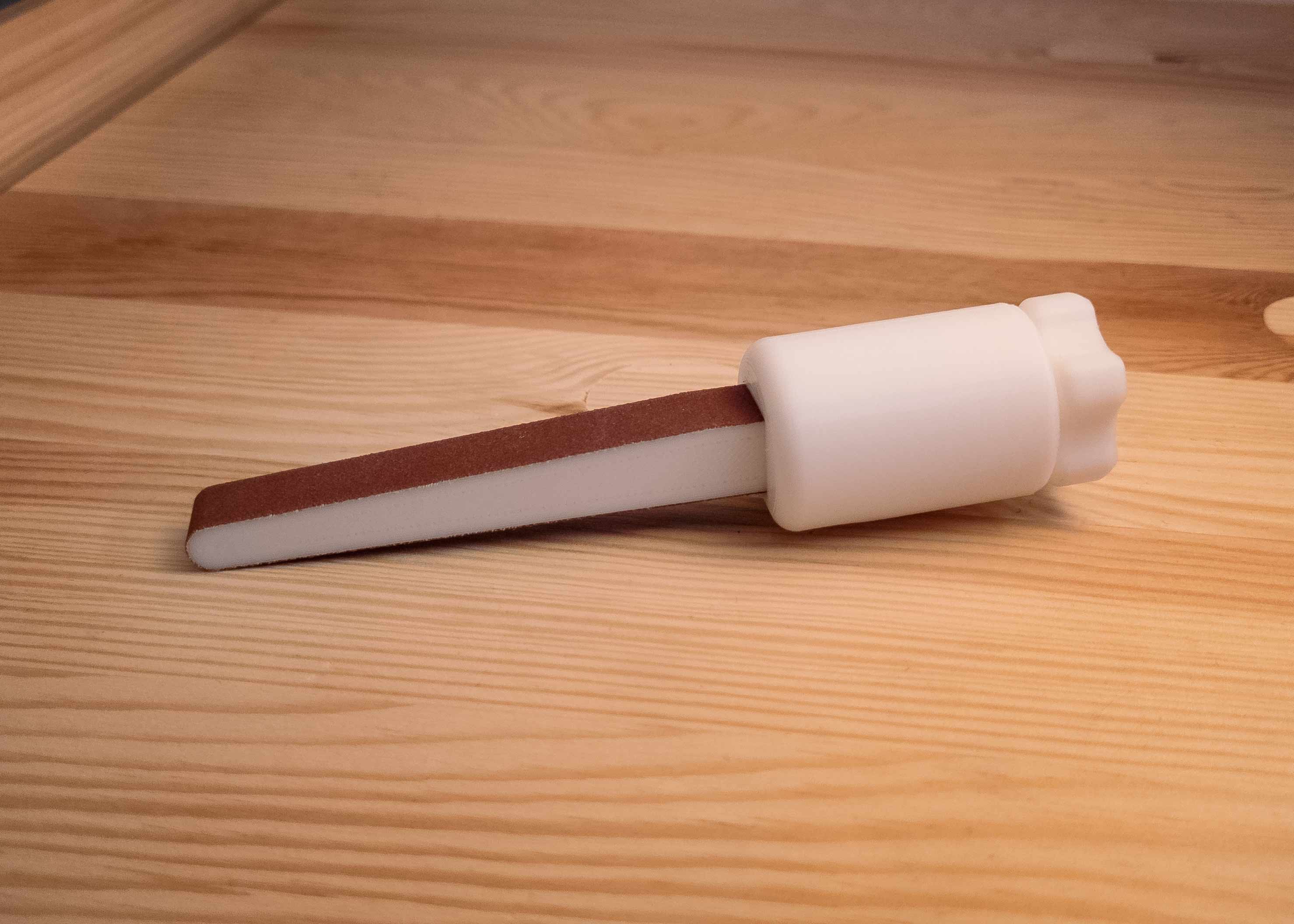 Sandpaper stick with selftightening and clamping in one. by TORX1