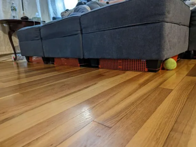 Toy blocker for under the couch