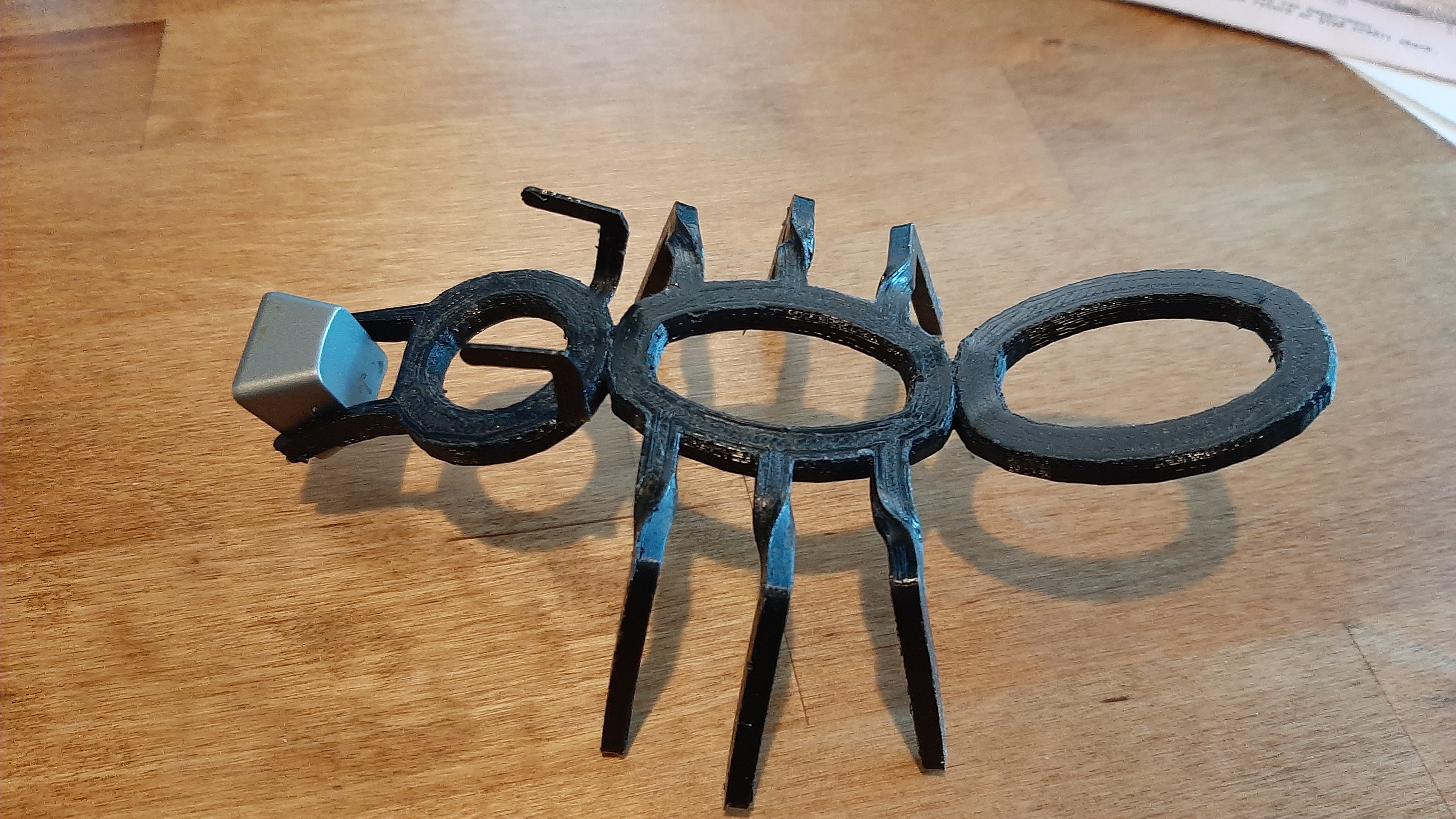 Ant shaped cap puller
