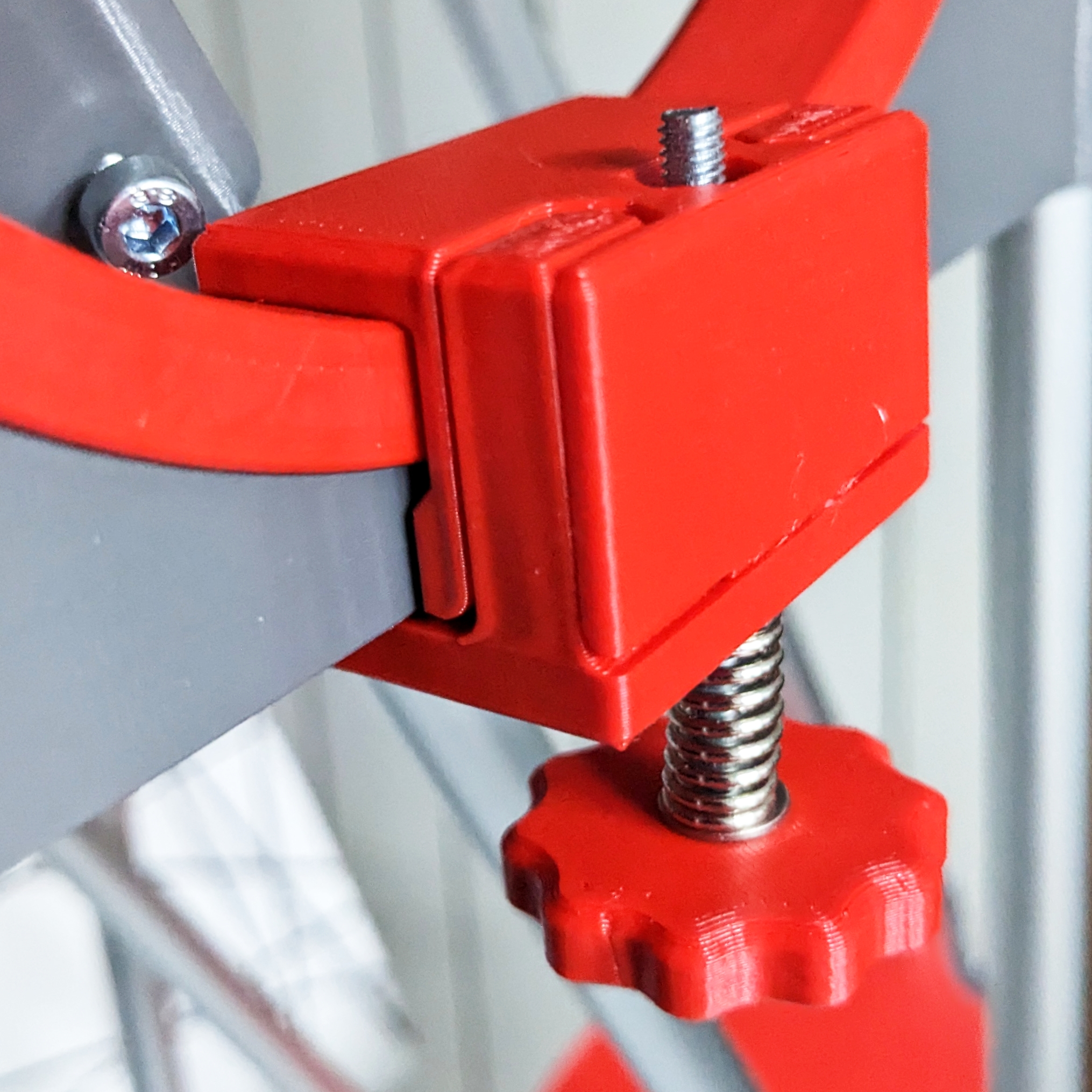 Adjustable pressure clamps for Hadley telescope altitude bearings
