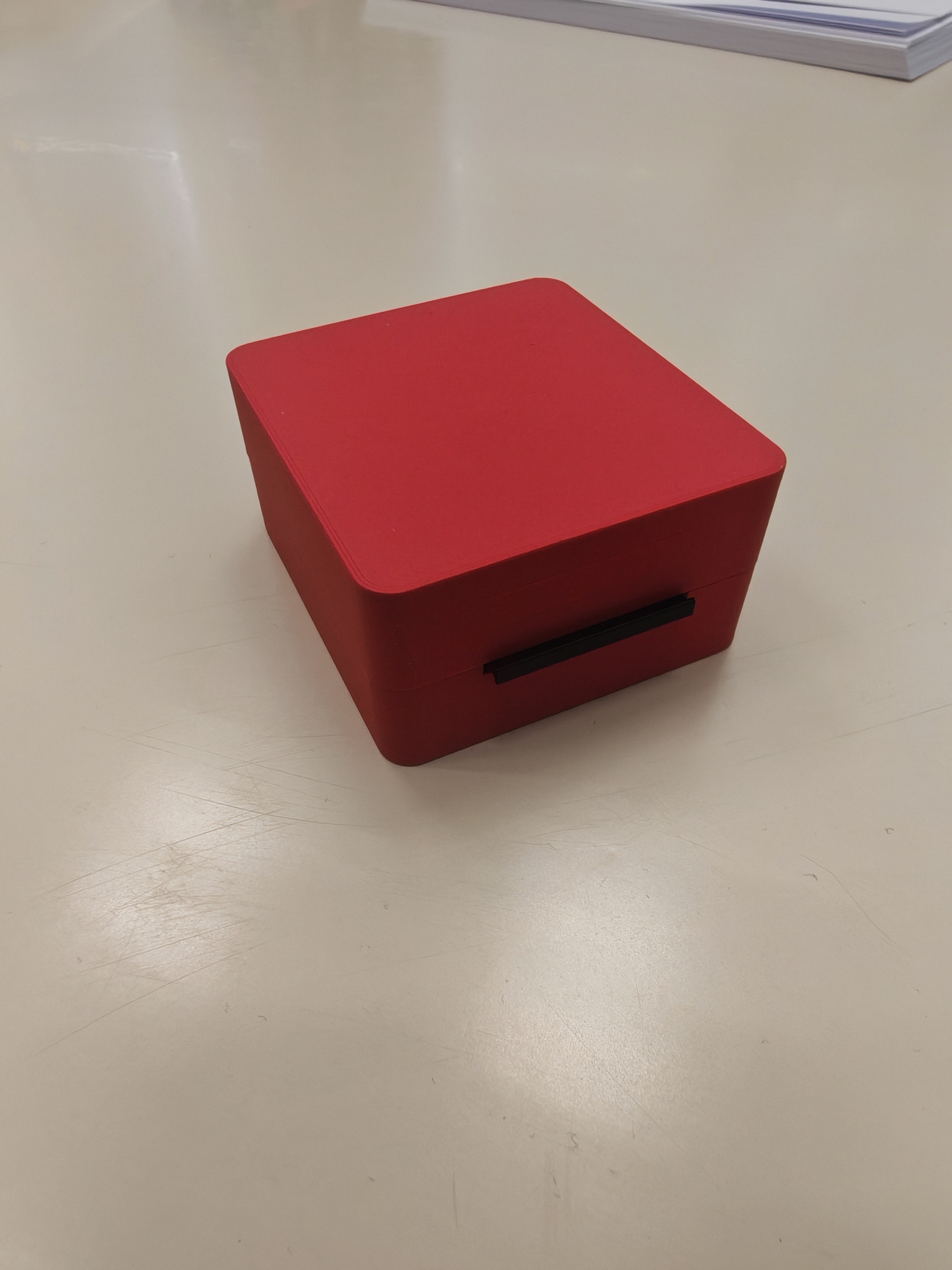 Small hinged box with compliant latch