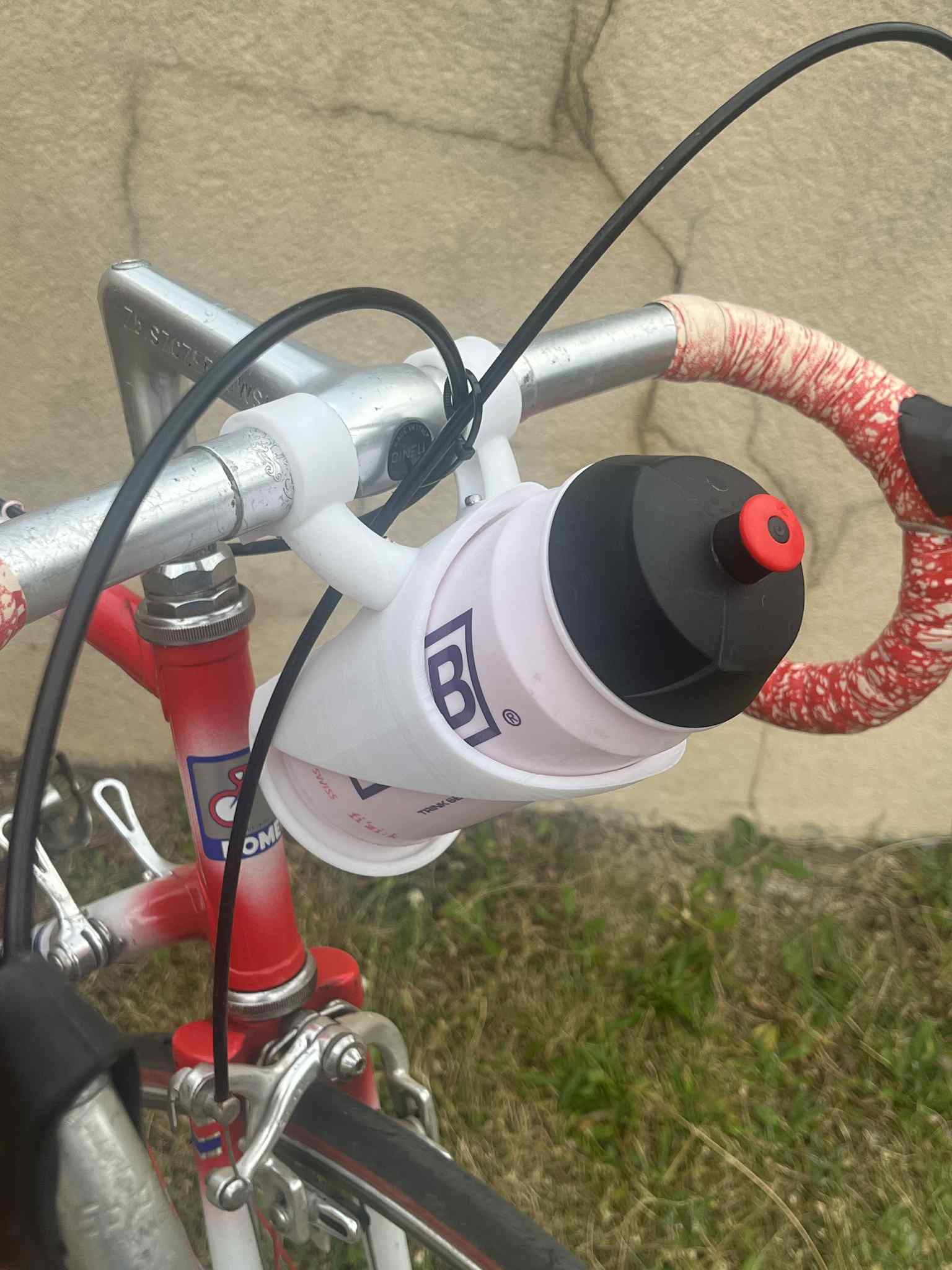 bottle holder for bicycle handlebars