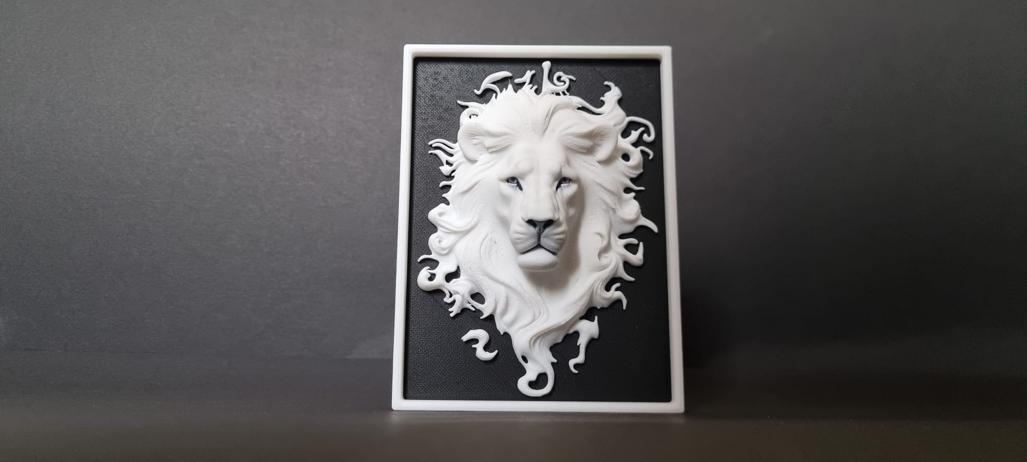 Bas-relief sculpture of a lion's head