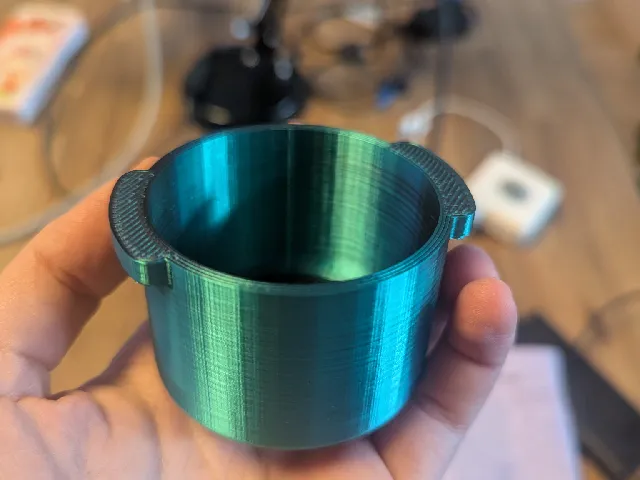 Portafilter shaped scoop for coffee grinder