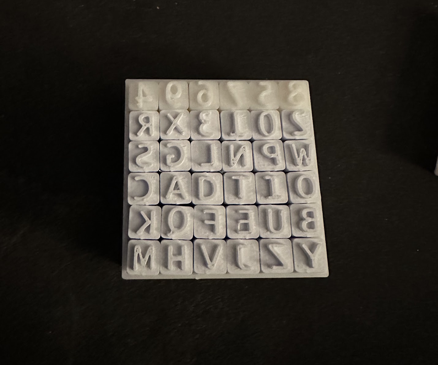 English Alphabet Stamps in a Box