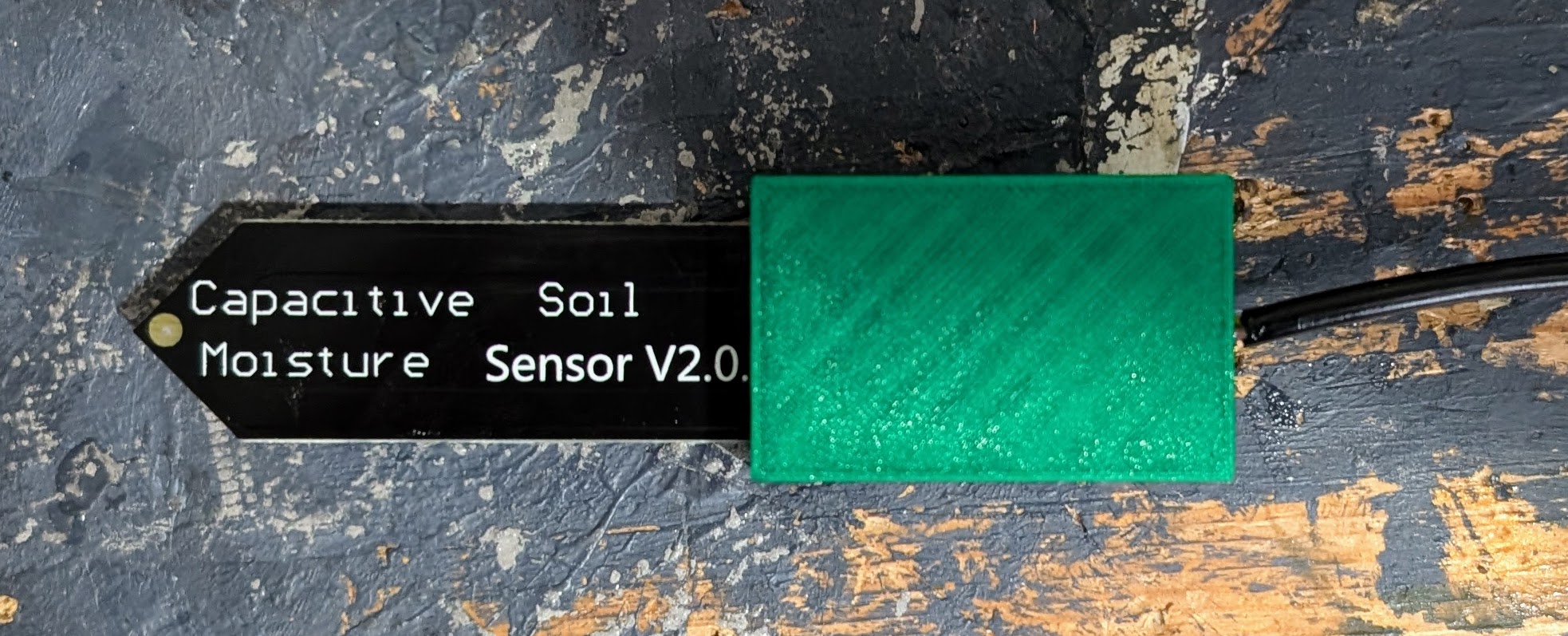 Cap for sealing soil moisture sensor with silicone