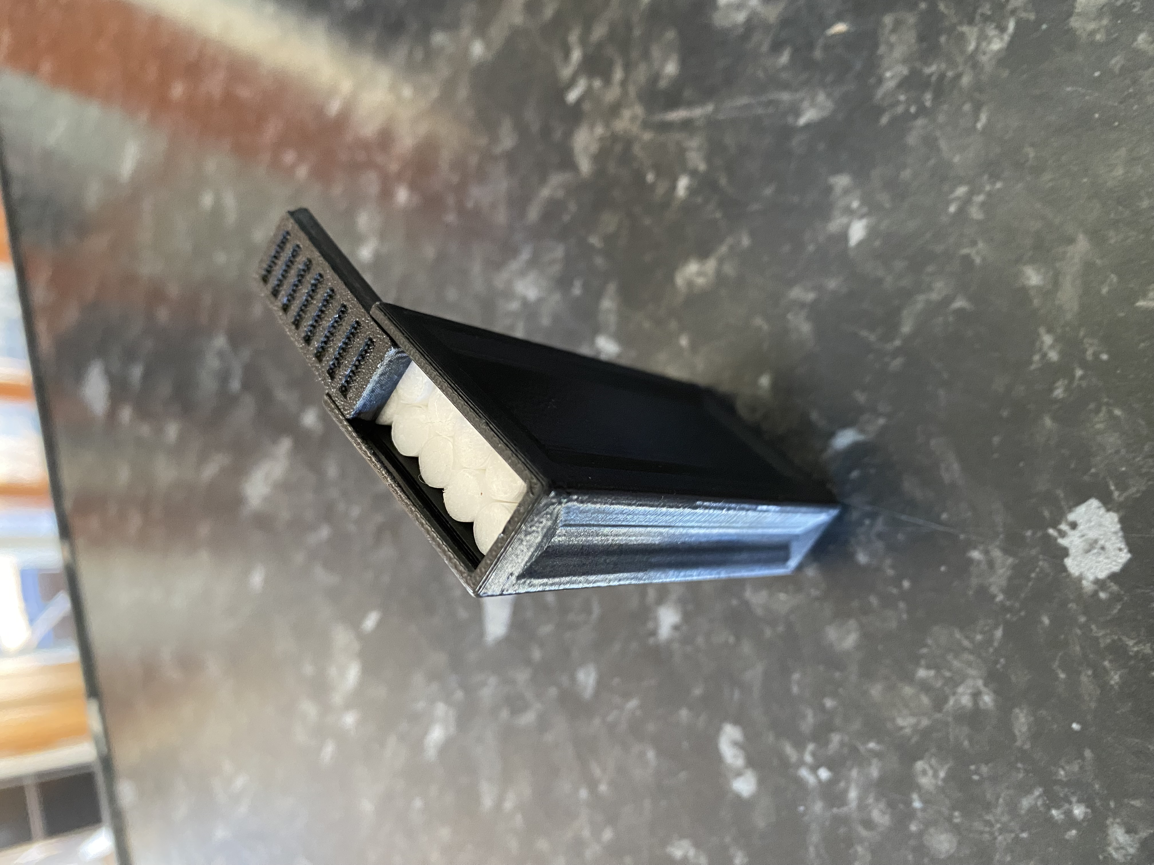 Cigarette container/box with sliding lid.