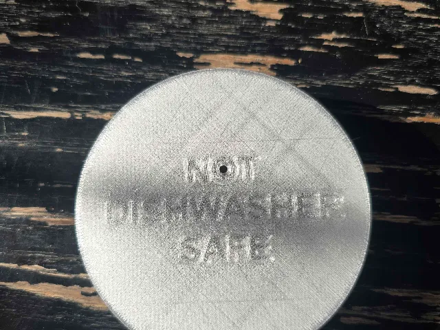 Ember mug cover with vent hole and grip tab