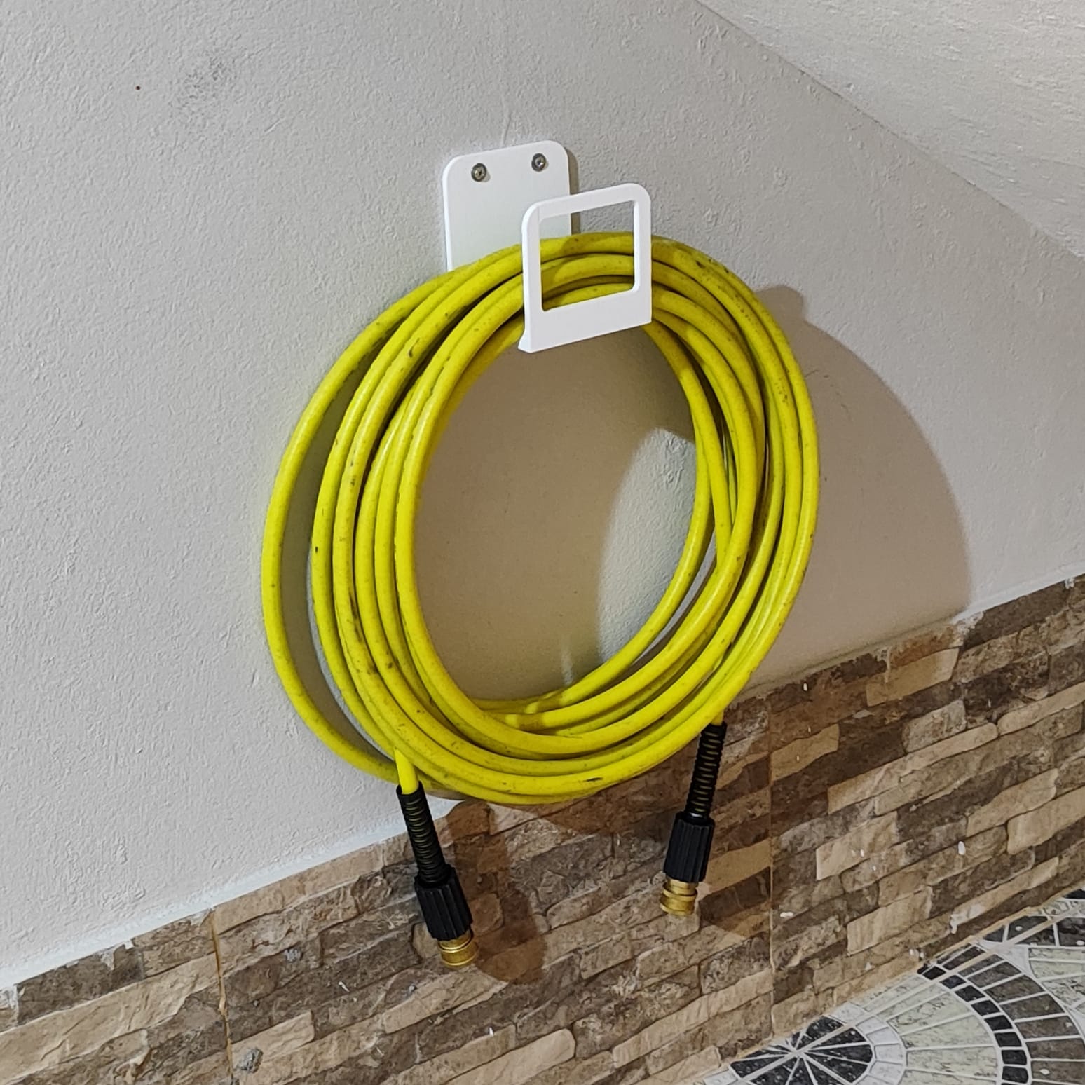 Pressure washer hose holder