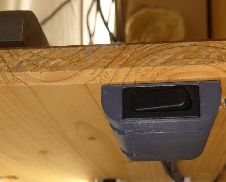 Under-counter housing for a rocker switch