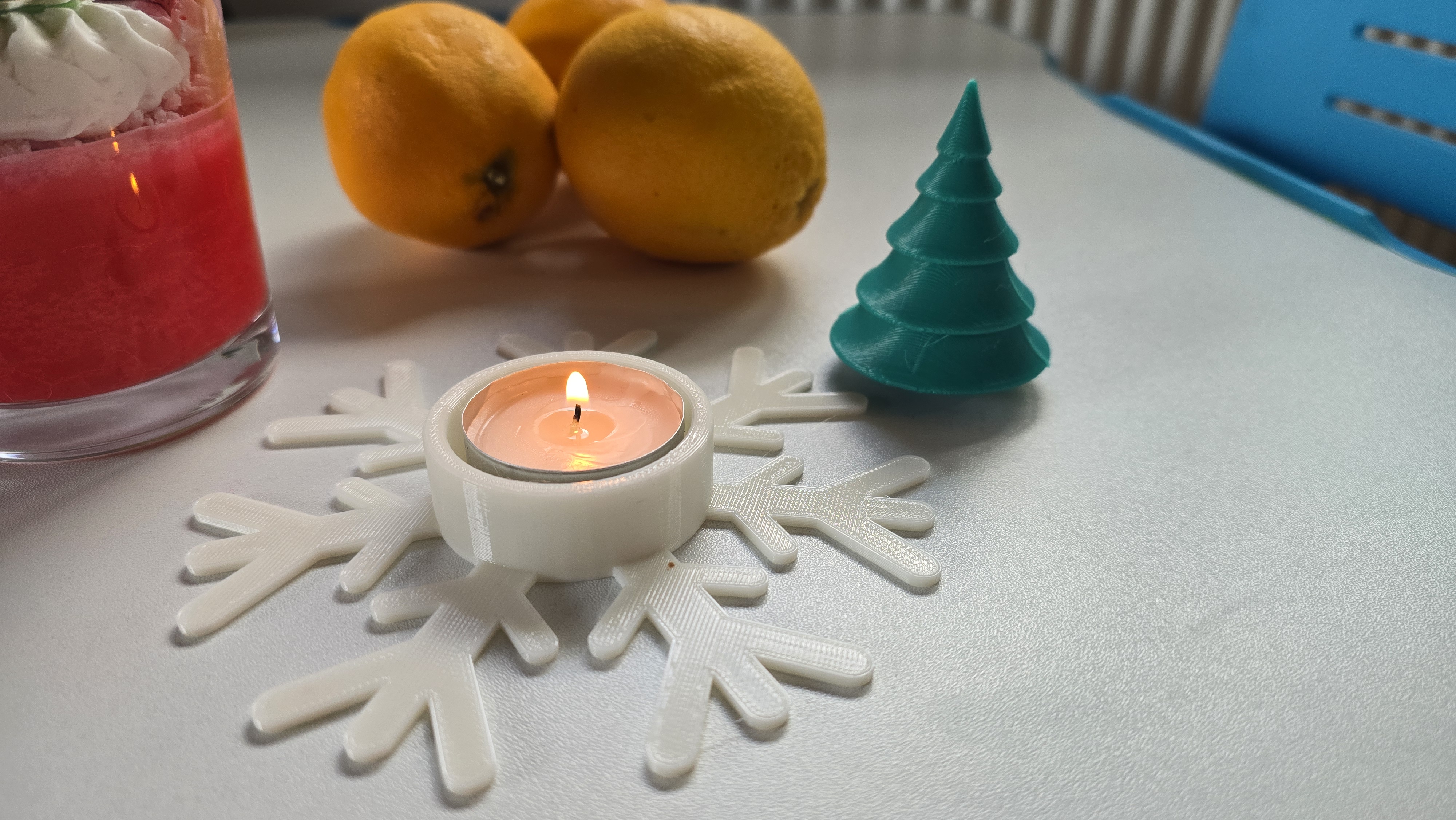 Snowflake candle decoration with tree ornament
