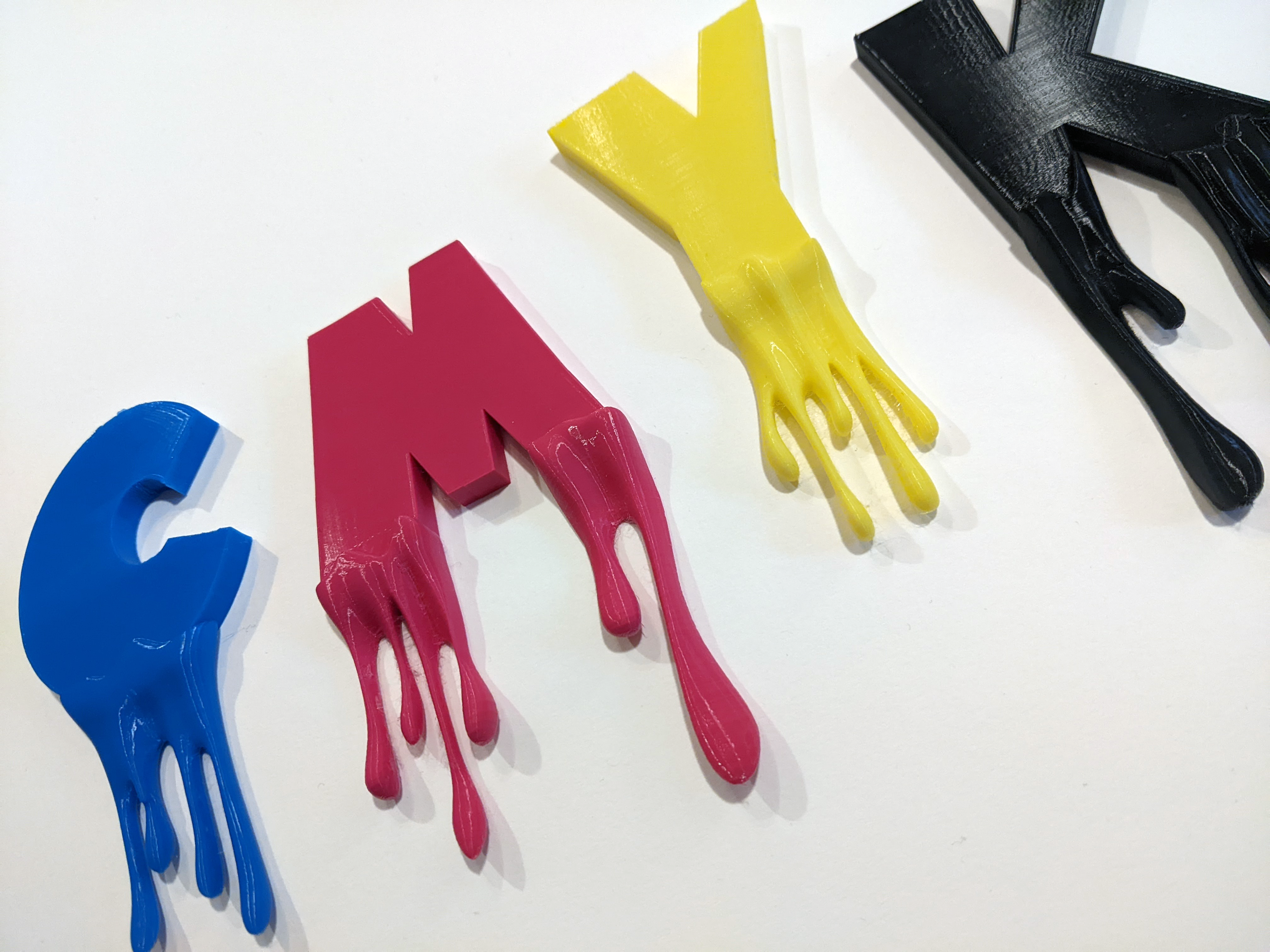 CMYK letters with dripping paint
