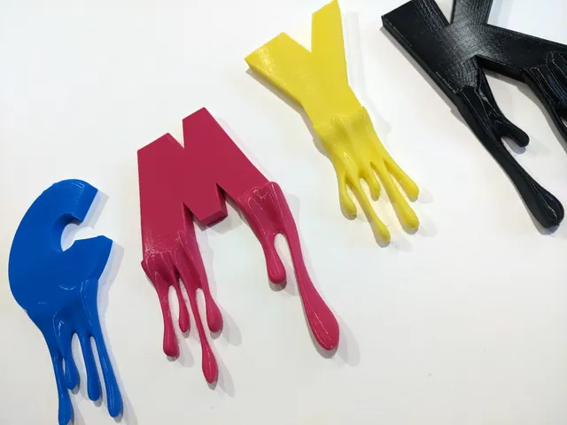 CMYK letters with dripping paint