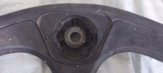 a fitted steering wheel center cap fits perfectly
