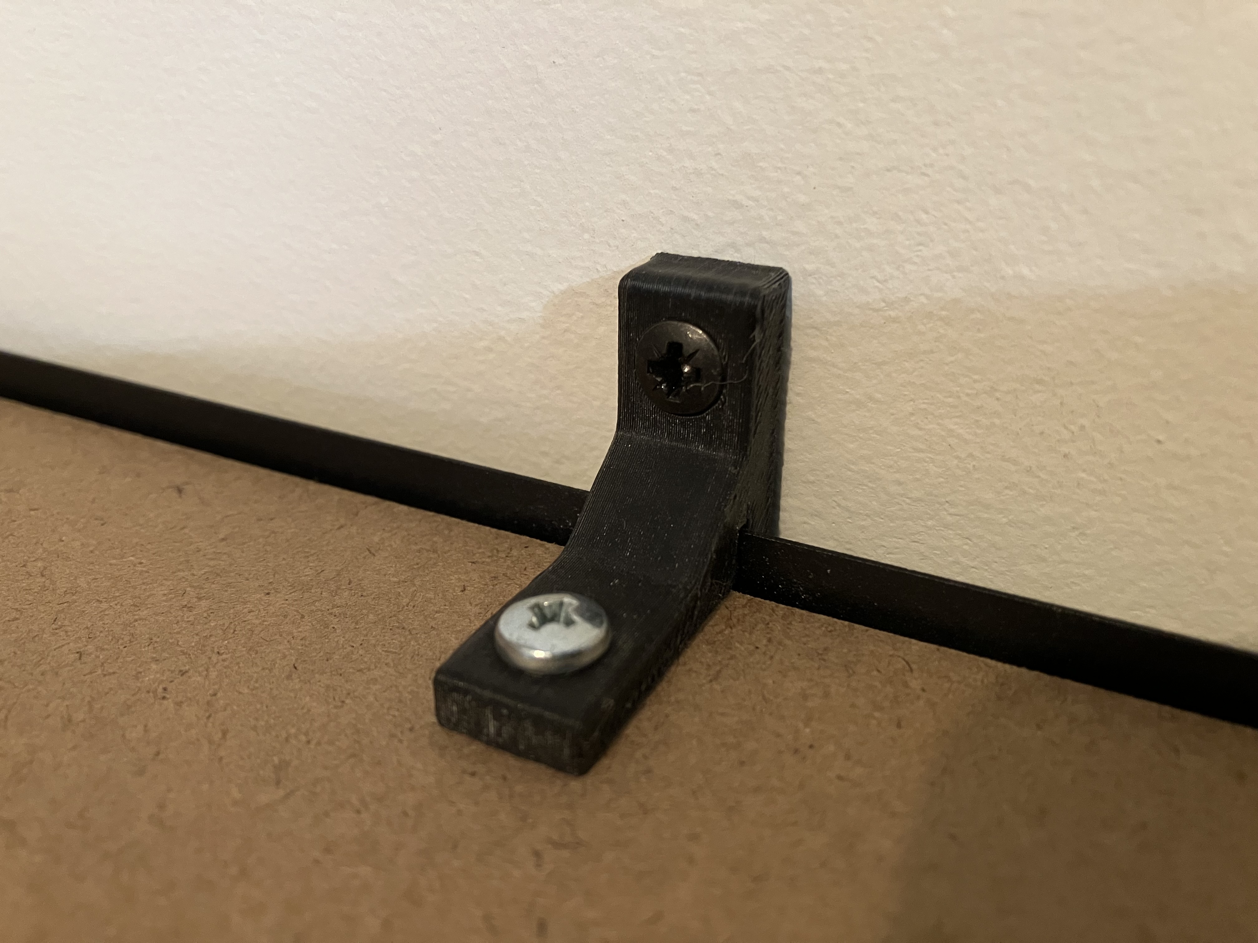 Anti-tip bracket for shelving rack