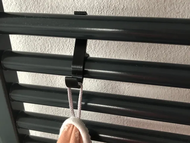 Hook for towel radiator