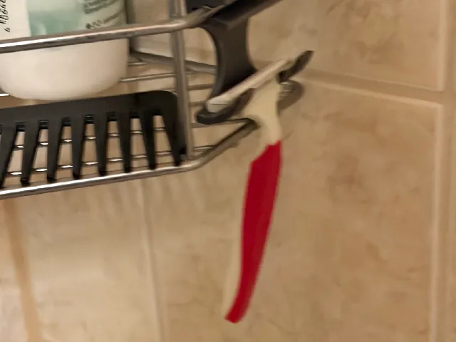 Shaver holder for shower wire basket - snaps on