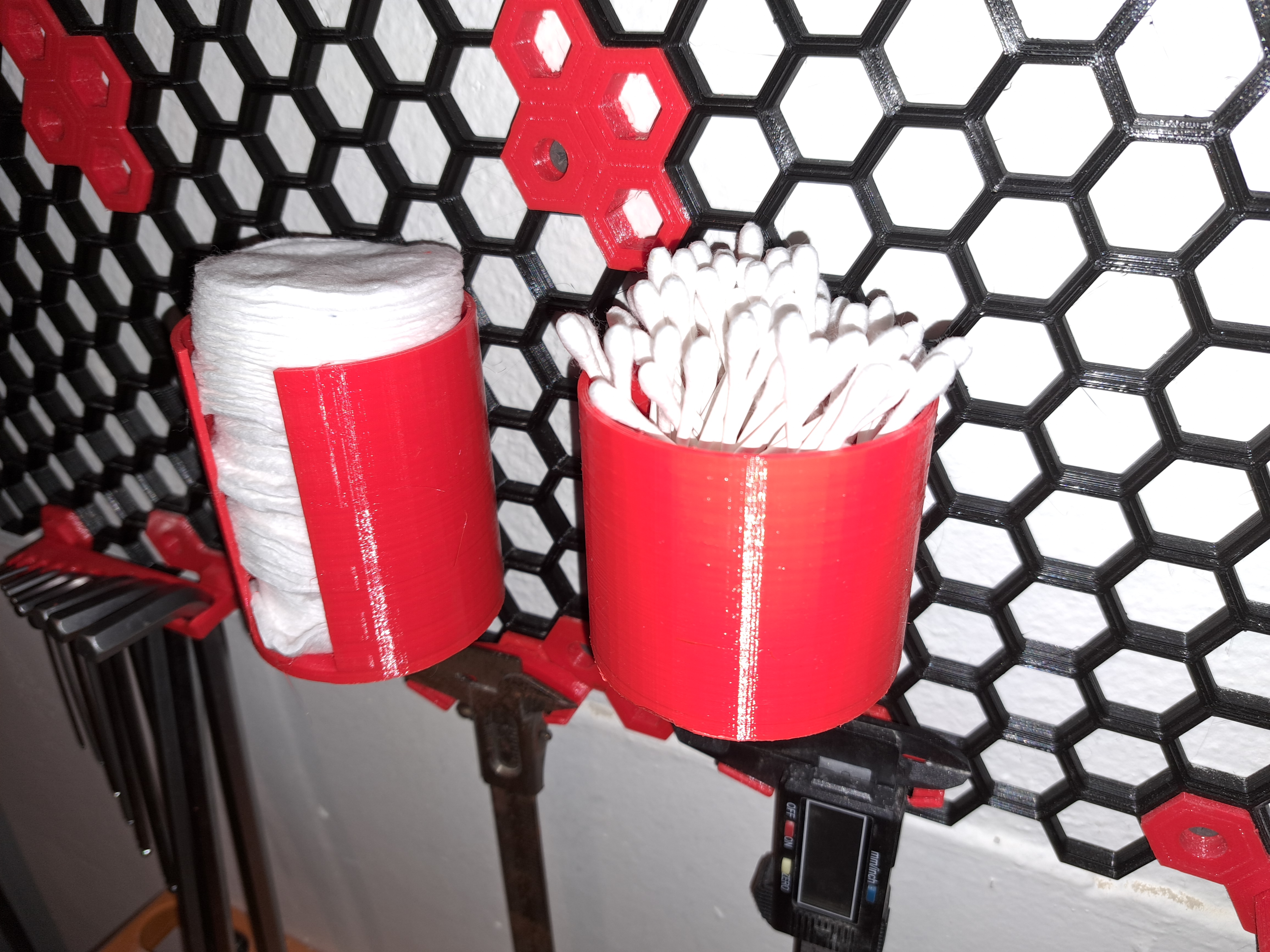 Cotton buds dispenser for honeycomb storage wall