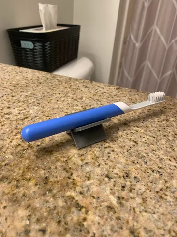 X Shaped Brush Holder- The two-piece toothbrush holder