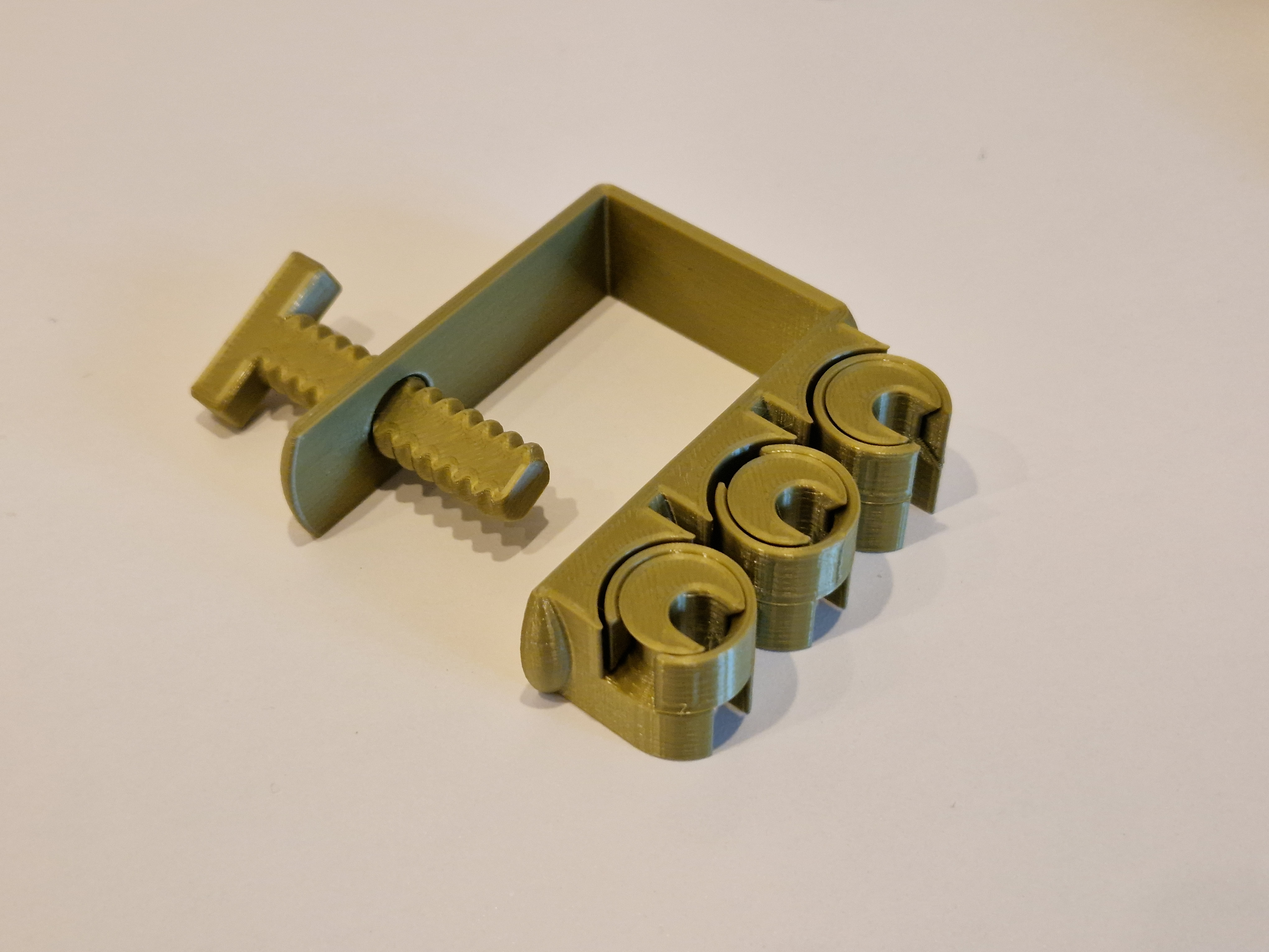 Parametric cable holder with cable lock and clamp