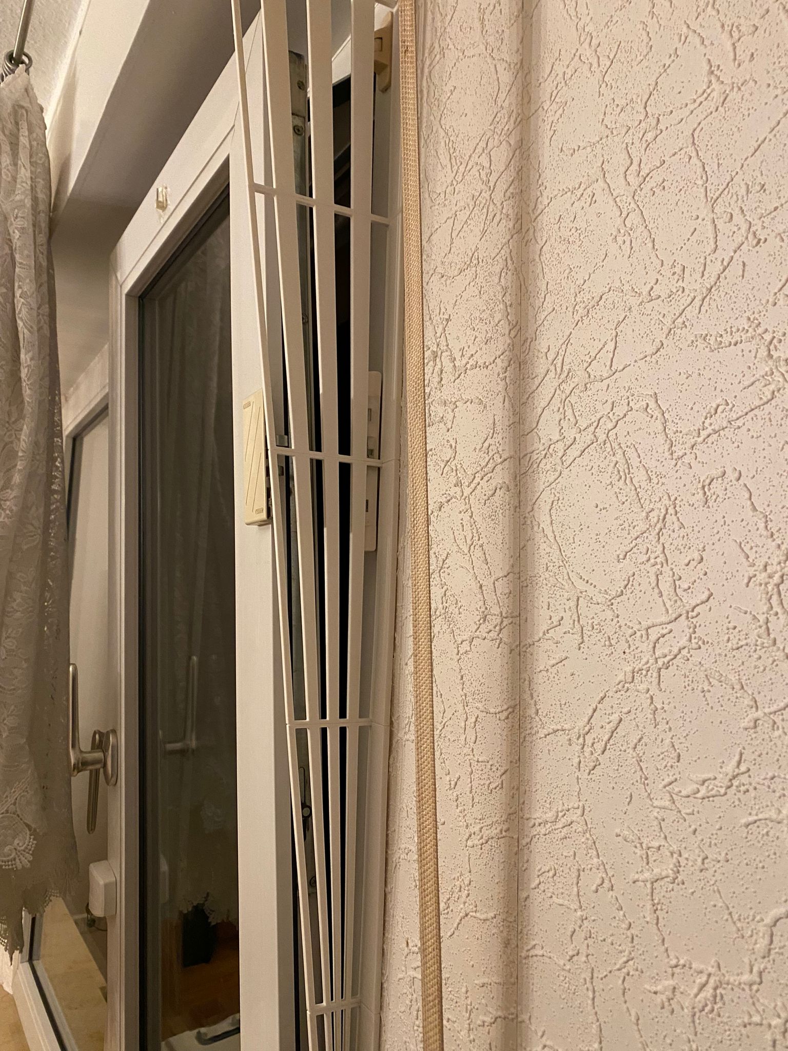 Cat protection grilles for bottom-hung windows
